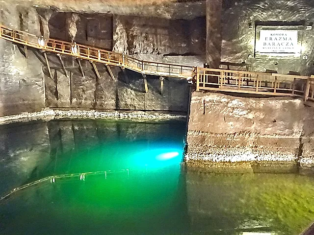 The underground lake in the Erazm Barącz Chamber, crossed by a wooden walkway